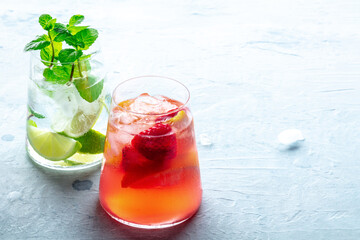 Summer cocktails. Cold drinks with fresh fruit. Healthy mocktails. Glasses of lemonade with ice, with a place for text
