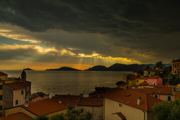 stormy sky over the sea in a seaside Italian town