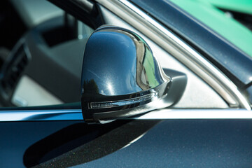 AUDI Q3 in black. Subcompact luxury crossover Audi Q3. Side mirror view