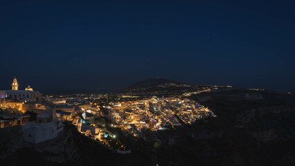Amazing night view of Fira (Thera) city in Santorini and amazing calderas.