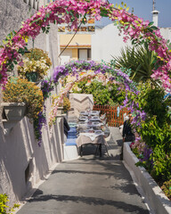Naklejka premium Streets and buildings in the street of Fira (Thera) city on the island of Santorini, Greece.