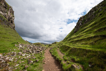 Fairy Glen on the Trotternish Peninsula, Uig Isle of Skye, Scotland UK. Varied landscape with small grassy hills, valleys and water ponds in the north of Skye.