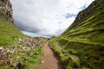 Fairy Glen on the Trotternish Peninsula, Uig Isle of Skye, Scotland UK. Varied landscape with small grassy hills, valleys and water ponds in the north of Skye.