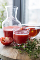 Freshly made and homemade red tomato juice. Tomato-based healthy breakfast or drink