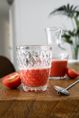 Freshly made and homemade red tomato juice. Tomato-based healthy breakfast or drink
