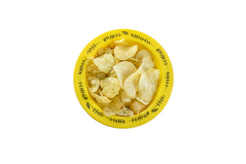 Potato chips in a yellow bowl isolated