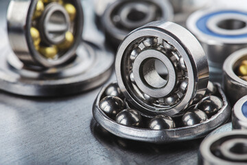 Obraz premium different bearings on a metal background. Part of mechanism.