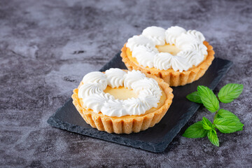 Creamy cheesecake cake on a gray table