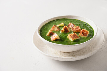 Palak Paneer served with chapati and basmati rice isolated on white background. Indian vegetarian...