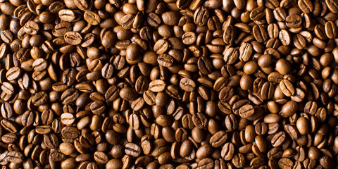 Background of roasted coffee beans full frame. A coffee-themed banner.