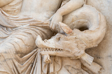 Close-up on dragon head sculpted in marble