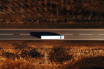 Freight transportation and logistics from above, drone photography of truck on the road