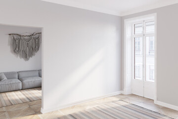 Empty bright room with sunlight on the blank wall between the balcony door and the doorway to the living room with a gray sofa, macrame, and striped carpet on the parquet floor. 3d render