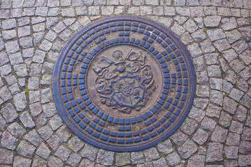 Beautiful manhole bronze cover in Wroclaw 
