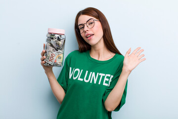 young adult pretty woman volunteer and donation concept