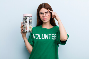 young adult pretty woman volunteer and donation concept