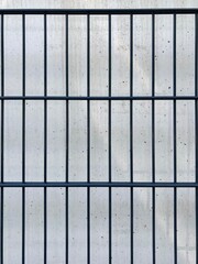 rectangular fence grid against light background