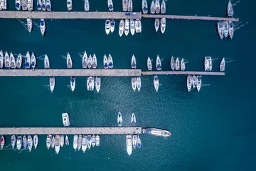 Foto op Plexiglas Aerial topdown view to a marina with moored luxury yachts and sailing boats in Greece © moofushi