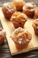 Vanilla muffins. Sweet cupcakes on cutting board. Top view.