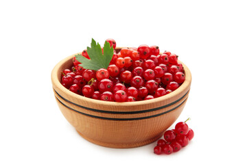 Red currant berries in a wooden bowl with leaf isolated on white background