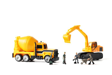 Miniature people : road repair work, teamwork concept