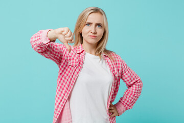 Young unhappy sad caucasian woman she 30s wears pink shirt white t-shirt showing thumb down dislike...
