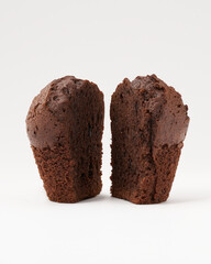 Chocolate muffin isolated on white background. Homemade cake. Sliced tasty cacao bakery.