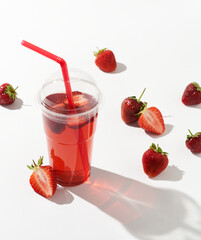 Strawberry lemonade with fresh strawberry in glass for healthy drinking isolated on white background. Refreshing summer drink.