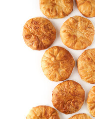 Freshly baked homemade pies isolated on white background, popular moldavian food served as snack or appetizer.    