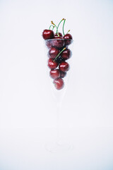 Sweet cherry dessert and fresh cherries in glass, selective focus