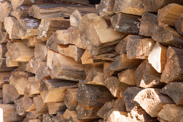 Folded stack of chopped drying log firewood