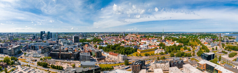 Fototapeta na wymiar Beautiful panoramic view of Tallinn, the capital of Estonia with an old town in the middle of the city. Aerial Tallinn view.