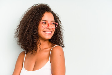 Young Brazilian woman isolated on blue background