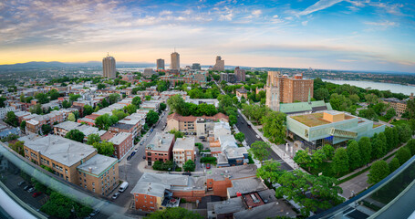 Naklejka premium Wide and panoramic aerial view of Quebec city cityscape at sunset, after a warm summer day, QC, Canada