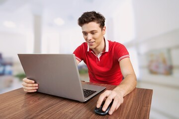 Young man work using computer hand typing laptop keyboard. student study learning education online