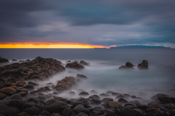 Sunrise on Reis Magos beach. Canico, Madeira, Portugal. October 2021. Long exposure picture