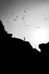 Man standing on cliff 