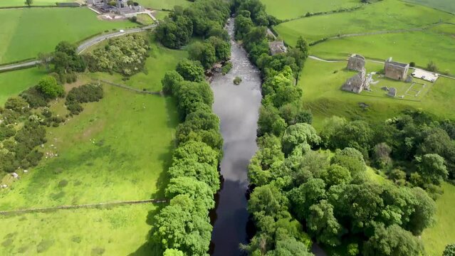 4k drone footage of the ruins of Egglestone Abbey near Castle Barnard in County Durham, UK