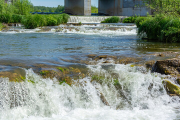 Fototapeta na wymiar Rapids near the dam of the former hydroelectric power station on the Suenga River