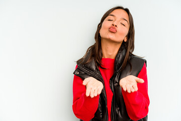 Young hispanic woman isolated on blue background doing a denial gesture