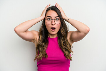 Fototapeta premium Young caucasian woman isolated on white background being shocked, she has remembered important meeting.