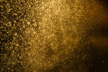 Fototapeta na wymiar Dark golden bokeh glitter texture background