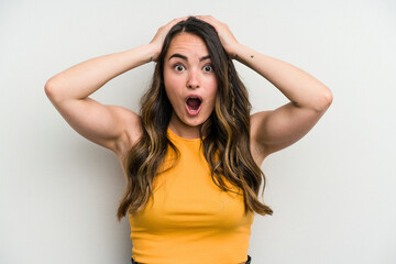 Fototapeta premium Young caucasian woman isolated on white background surprised and shocked.
