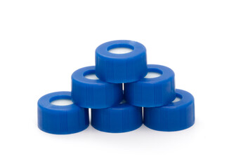 lot of blue plastic vial screw caps isolated on white background