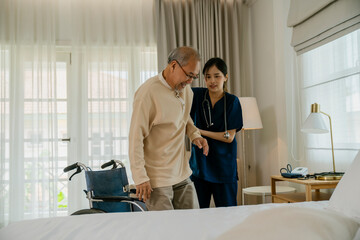 Elderly man with caregiver in nursing home.