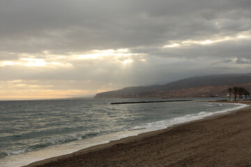 Hidden beach with Cloudy sky in Spain