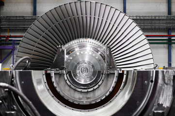 A powerful steam turbine rotor is installed in the lodgment of the steam turbine base. - obrazy, fototapety, plakaty
