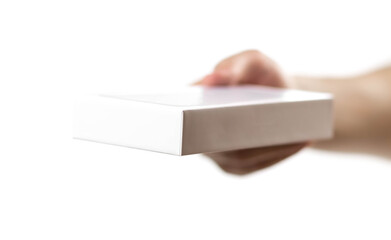 The hand holds a white box with a new smartphone. Close up. Isolated on a white background