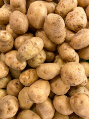 Fresh organic potatoes in the market. Close-up potatoes texture