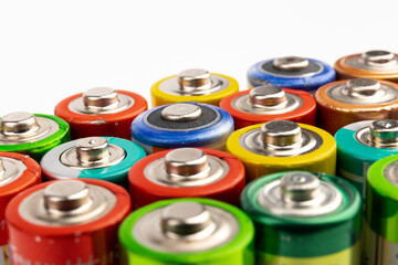 Composition with alkaline batteries on white background. Chemical waste. Top view.